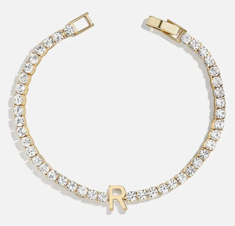 Gold diamond tennis bracelet with a letter R initial charm