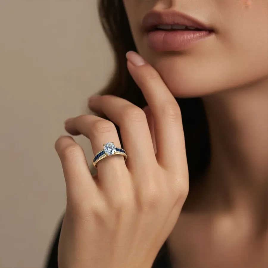 Gold diamond ring with sapphire accents worn on the hand